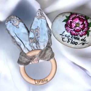 4BA2654D-7EC2-49D6-9648-E17BA89E3017.jpgv1709037255 Hochet bambi avec prénom gravé